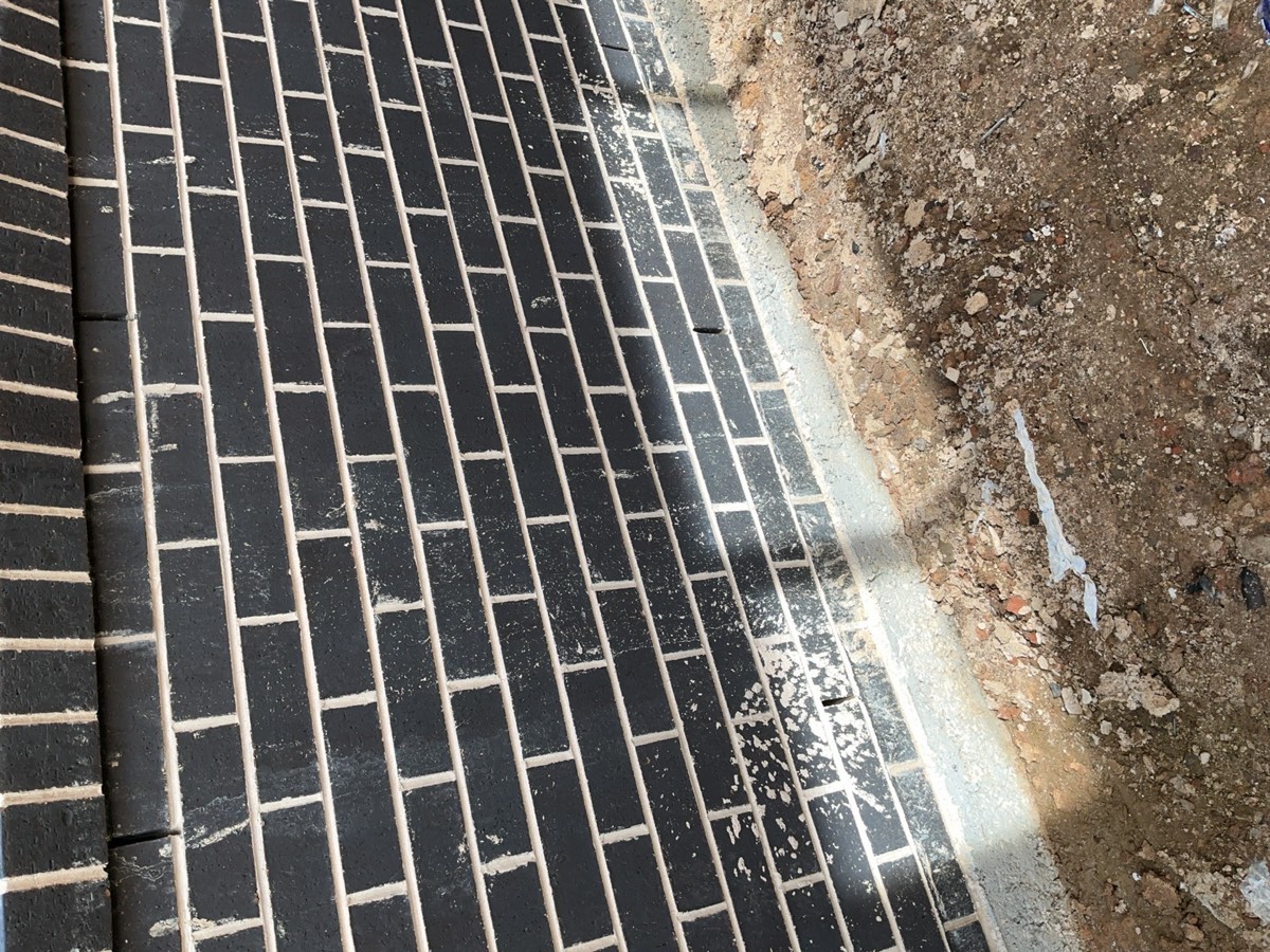 Acid wash required, recorded during a fixing stage inspection in Oran Park